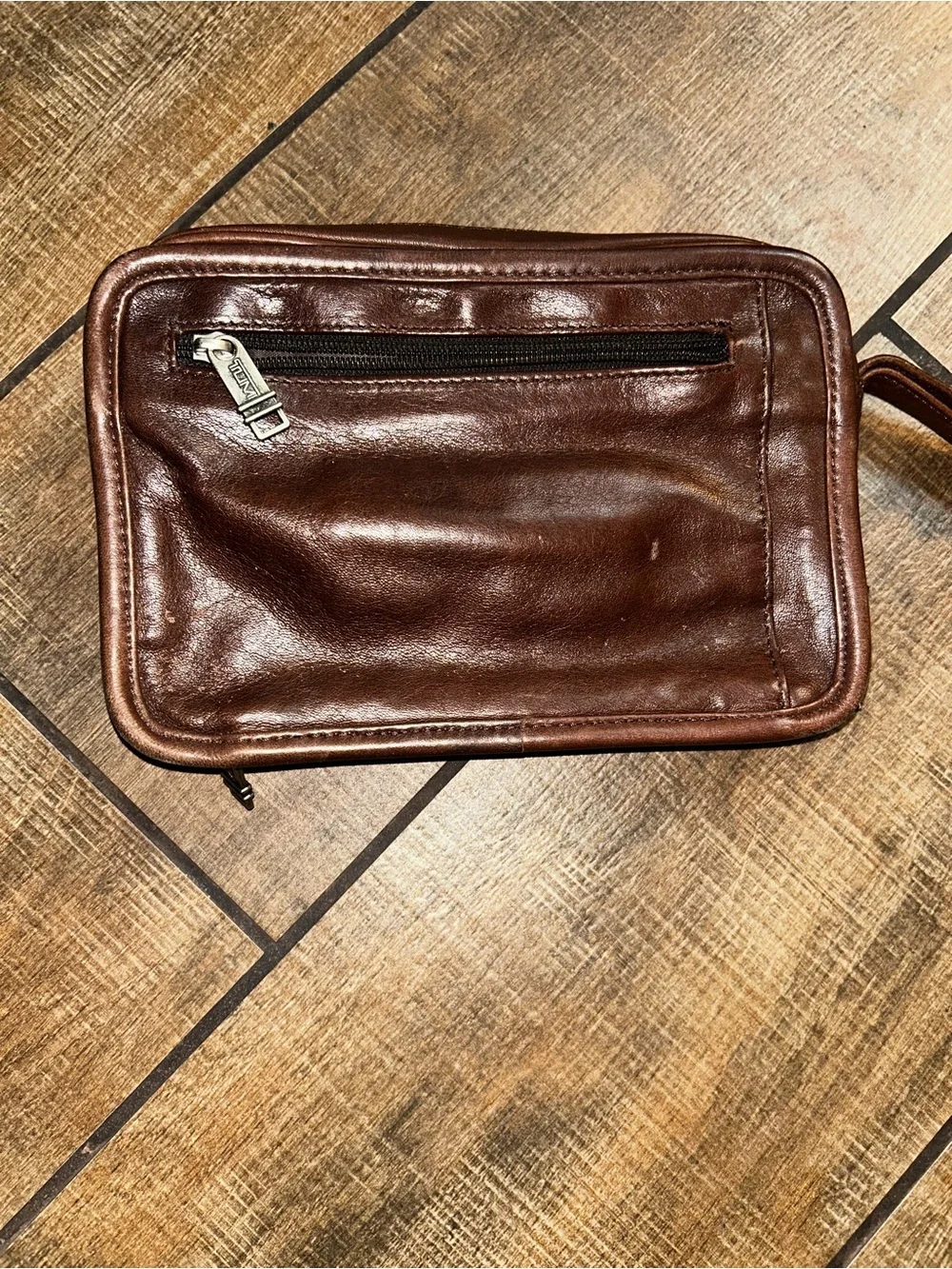 TUMI brown leather travel bag